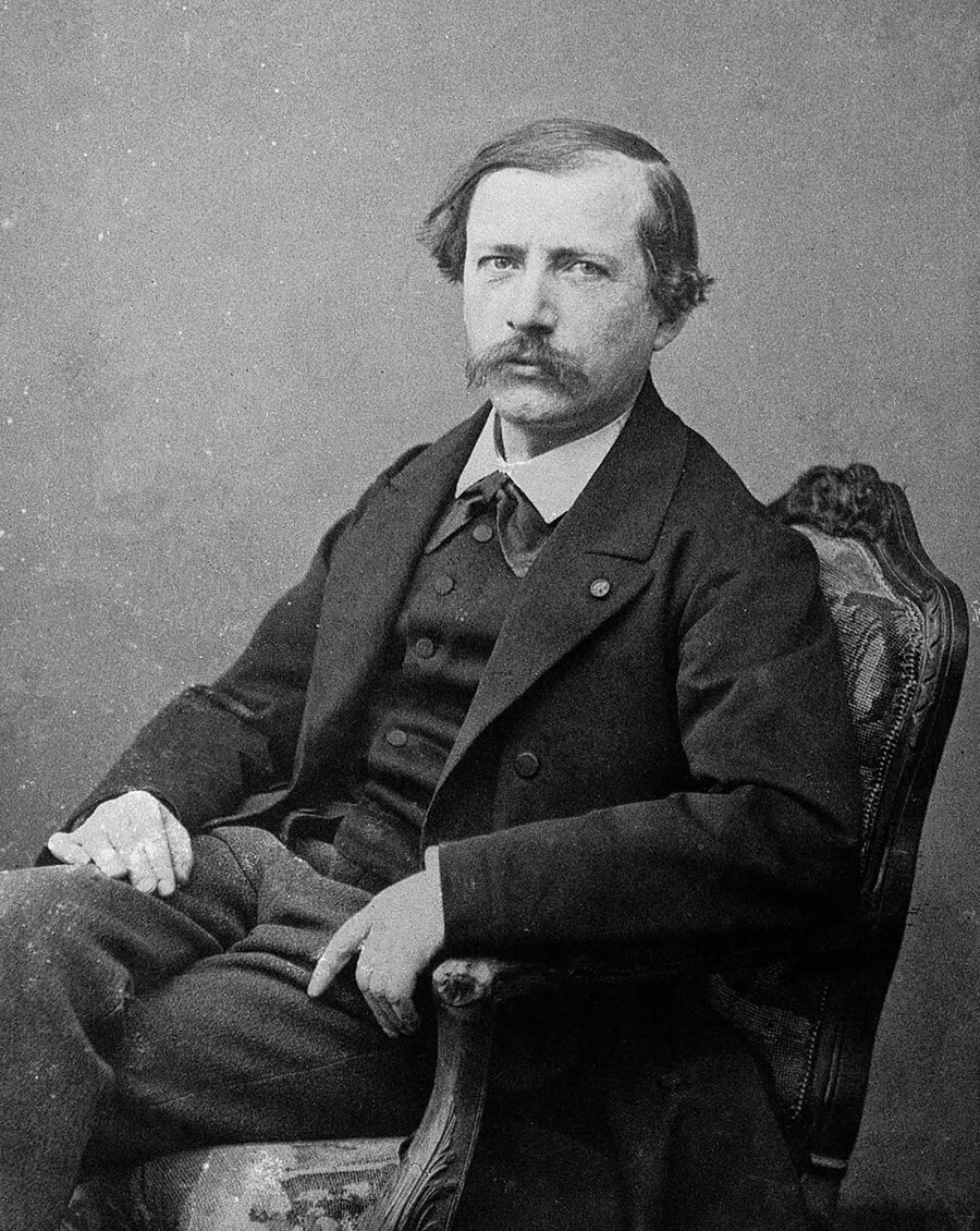 A photographic portrait of Marcellin Berthelot in later life, bearded, in a dark coat, facing the camera.