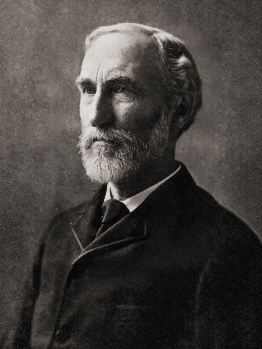 A photographic portrait of Josiah Willard Gibbs, in a dark suit and high collar, facing slightly right.