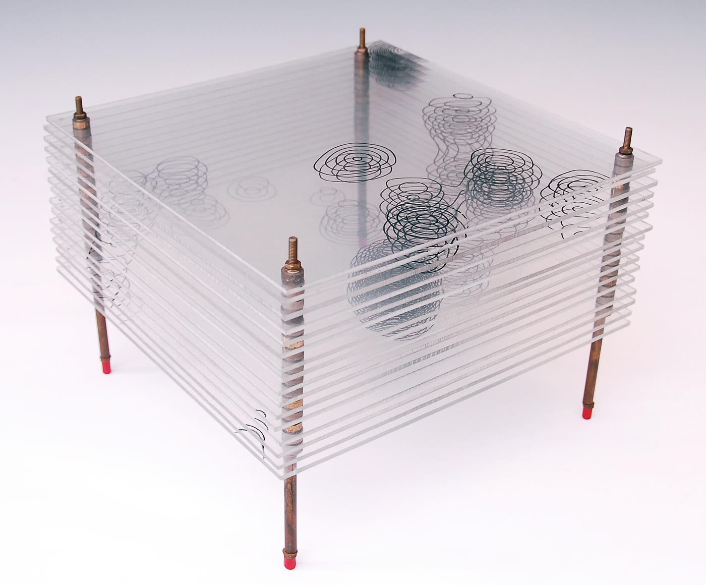 A three-dimensional model built from stacked transparent sheets, each carrying a contour map of electron density, with a schematic diagram of the penicillin structure beside it.