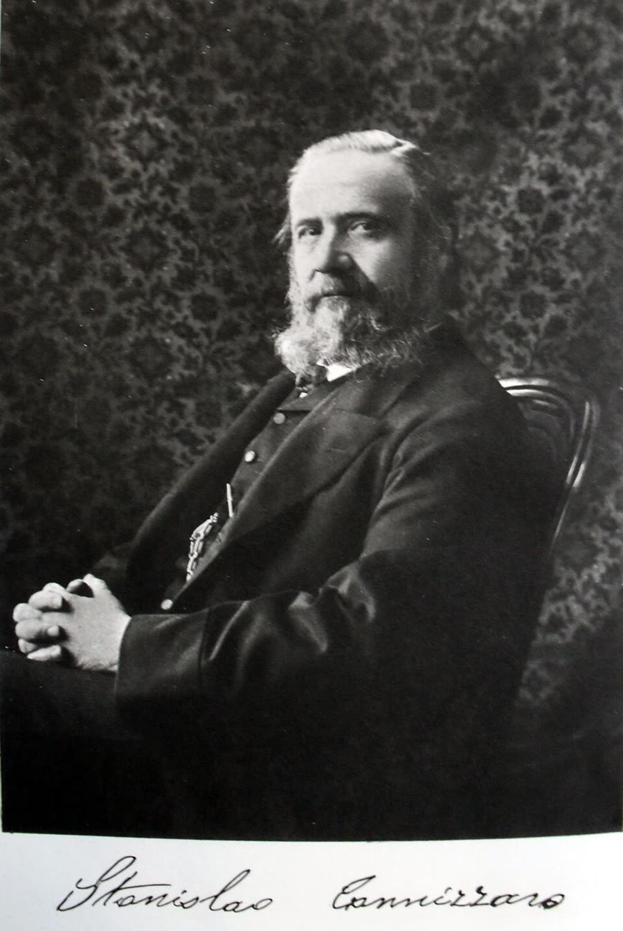 A photographic portrait of Stanislao Cannizzaro in later life, bearded, in a dark coat.