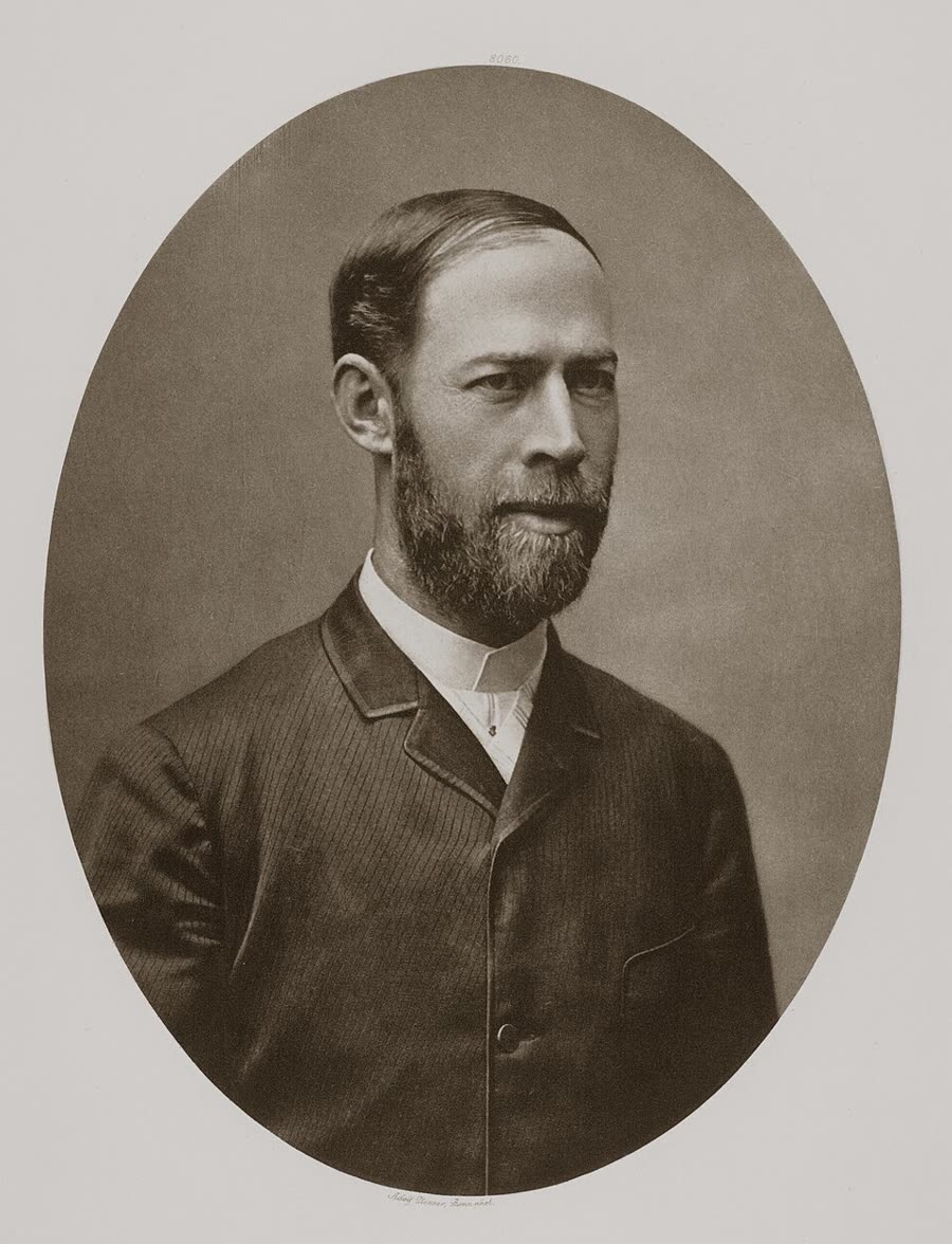 Photographic portrait of Heinrich Hertz as a young man with a moustache, in formal dress.