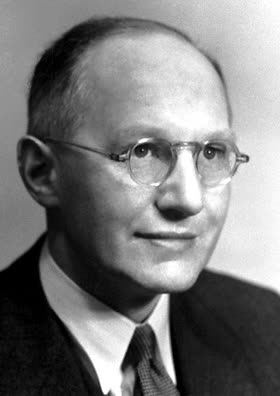 Portrait photograph of Ernest Walton in a suit.