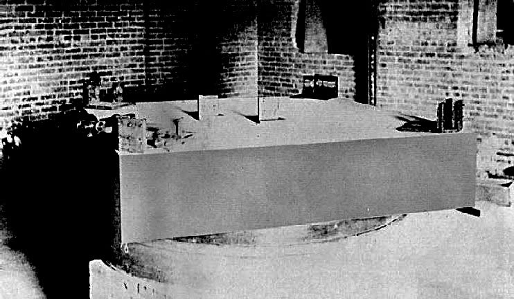 The 1887 interferometer: a square sandstone slab carrying mirrors, floating in an annular trough of mercury.