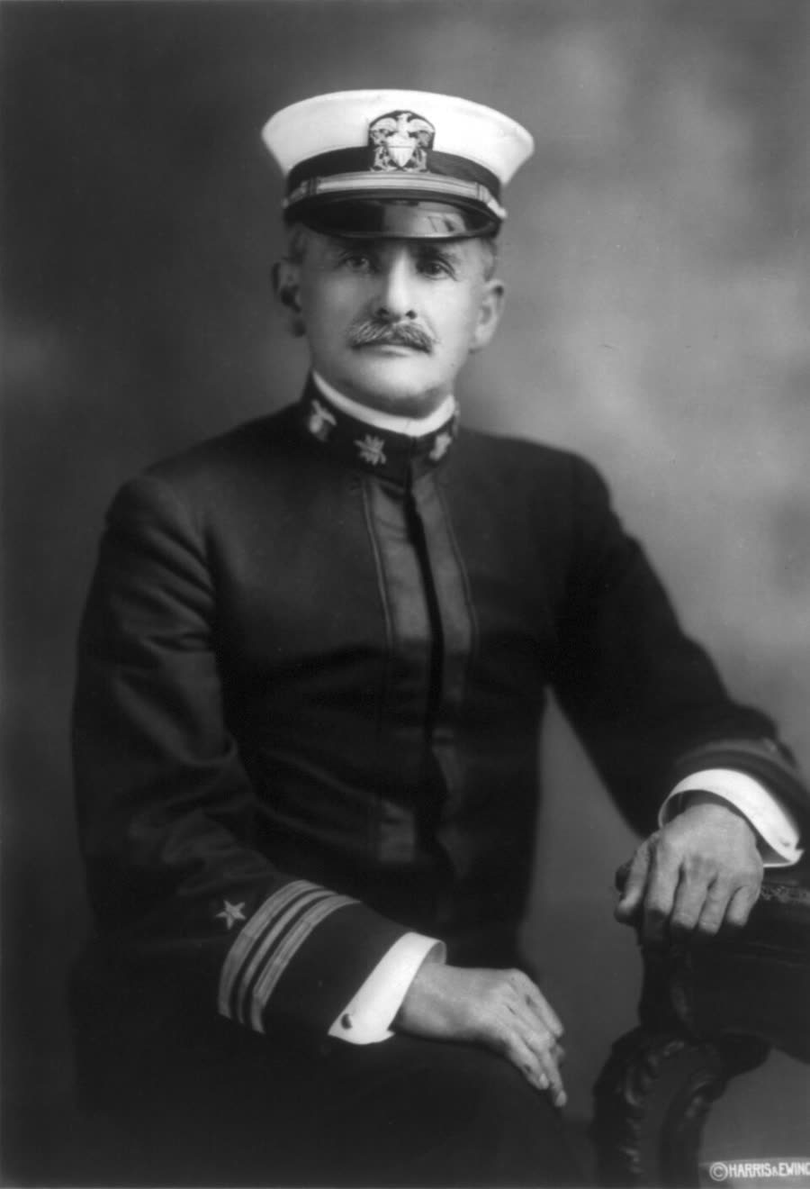 Studio portrait of Albert A. Michelson in later life, seated, in a suit.
