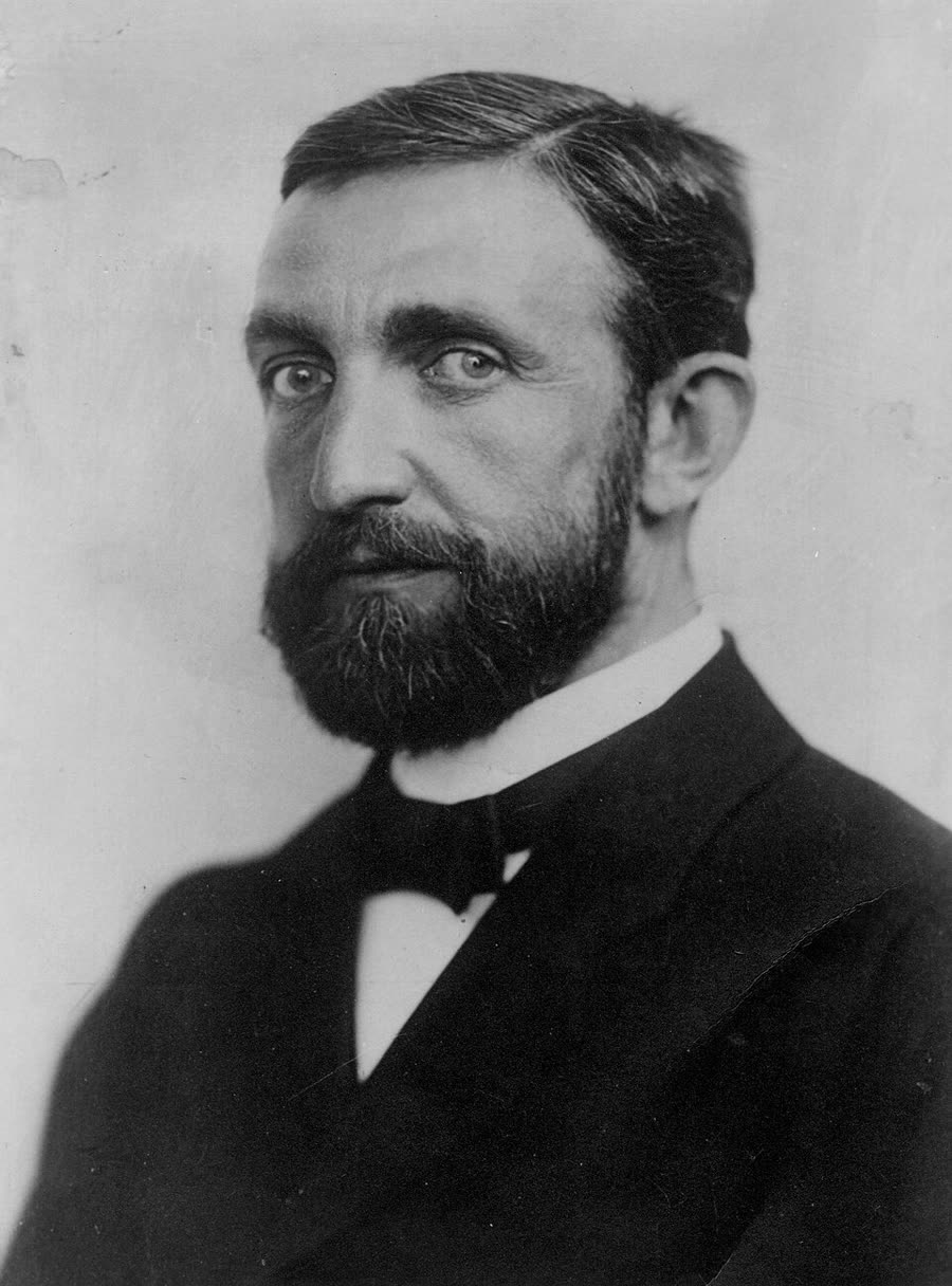 Philipp Lenard photographed in 1900, in a high collar and dark jacket.