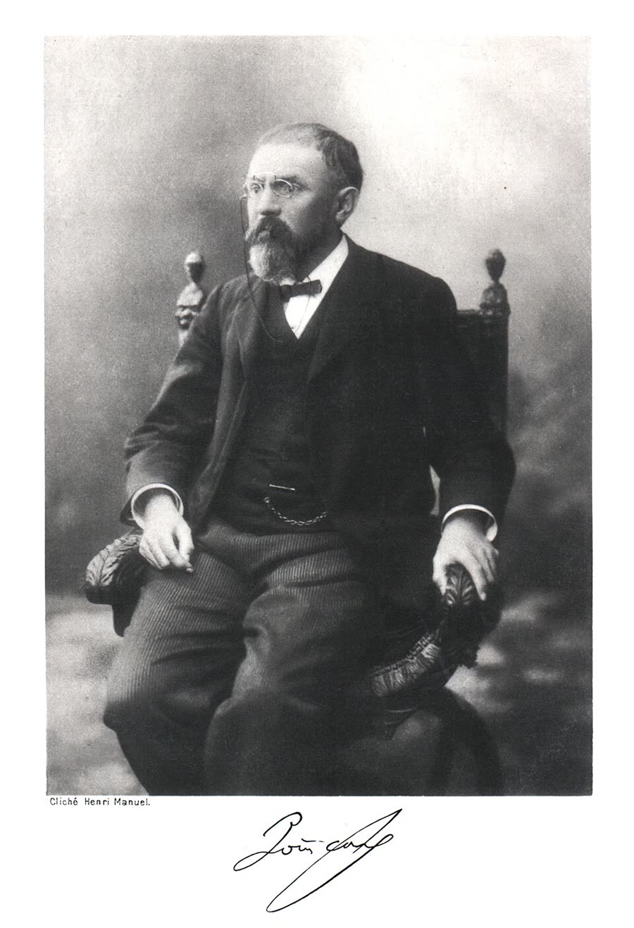 Photographic portrait of Henri Poincaré seated, with a full beard.