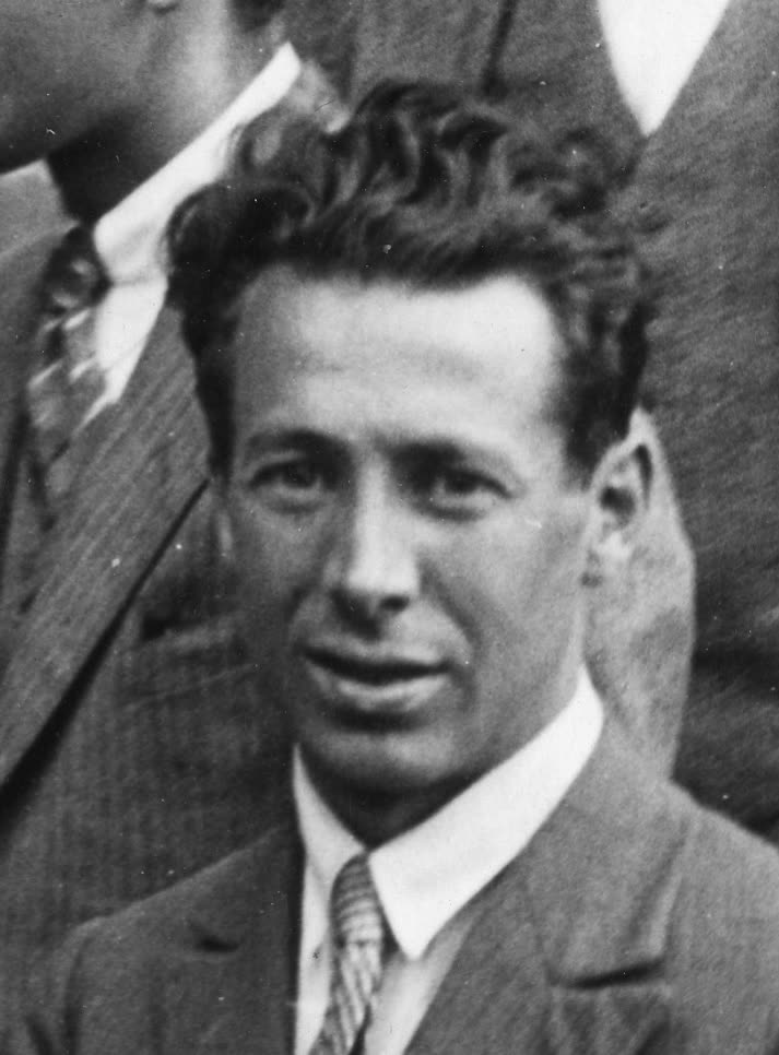 A photographic portrait of Walter Heitler, in a jacket and tie, facing the camera.