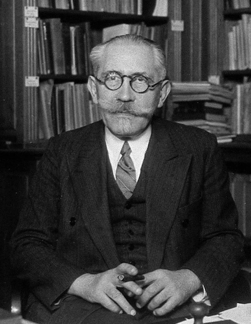 Photographic portrait of Paul Langevin in formal dress with a moustache.
